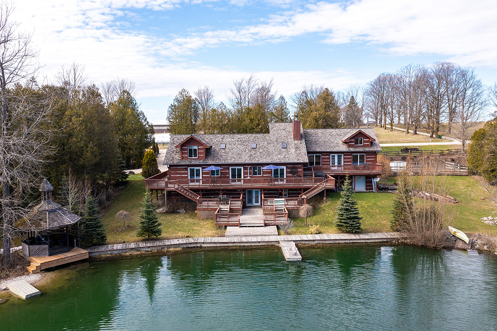 RETREAT LOCATED ON 50 ACRES WITH PRIVATE LAKE! 